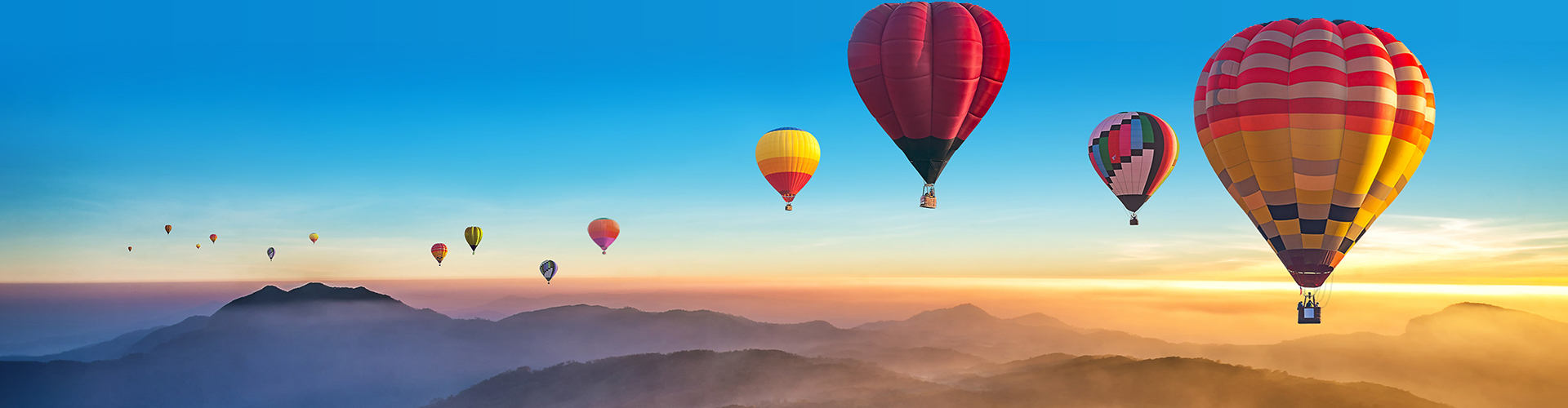 Hot-air balloons over a travel destination
