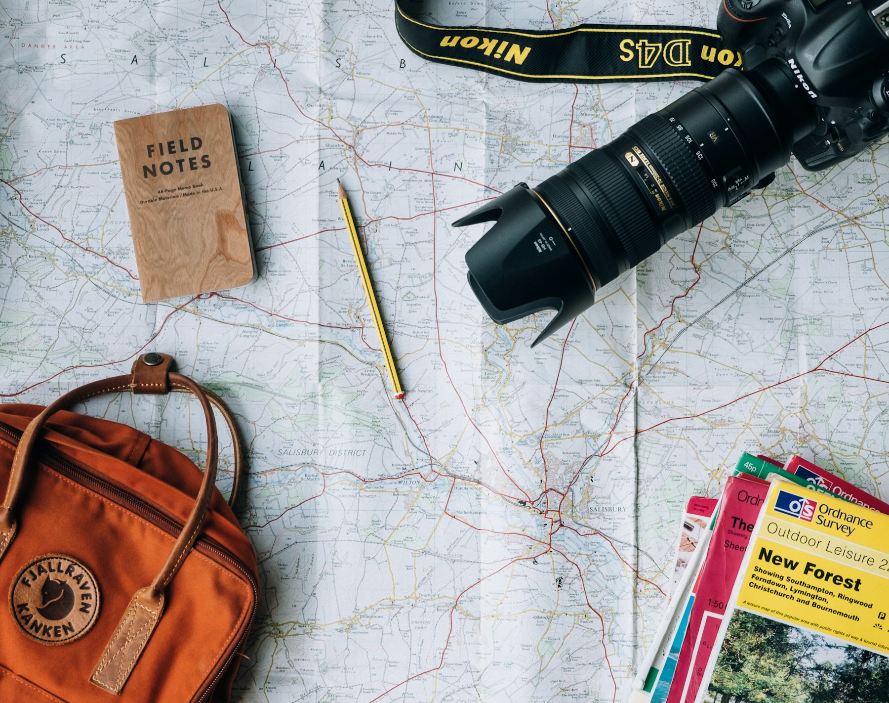 Travel map, notebook and camera for trip planning